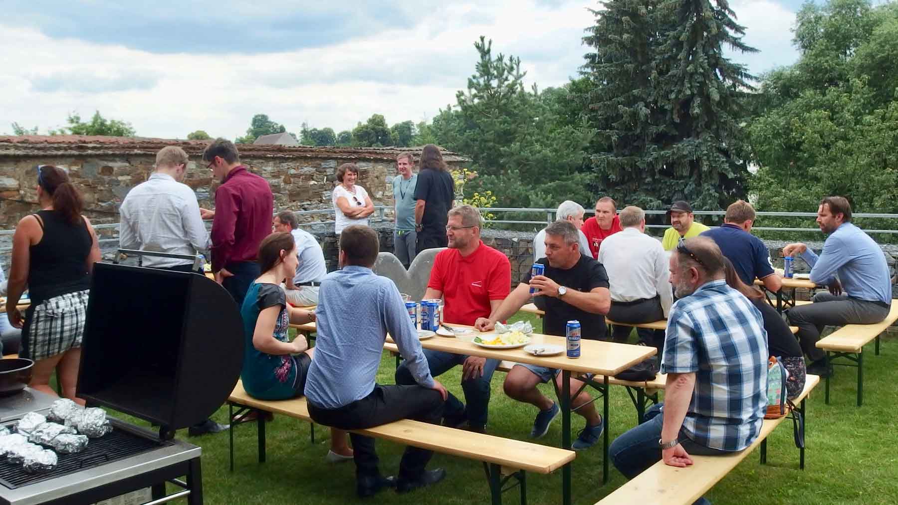 K-net an guests near grill during the seminar "Technologie bezpečnost a ochrana dat"