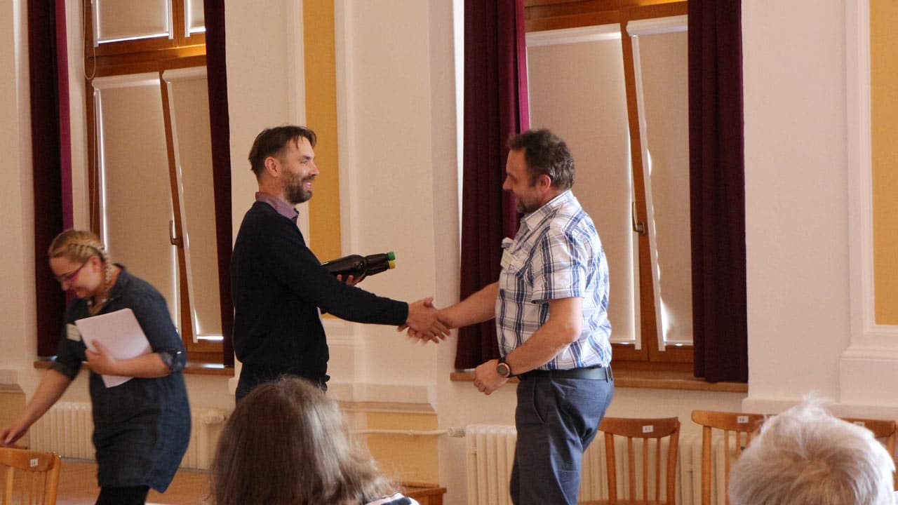 Petr congratulating a participant
