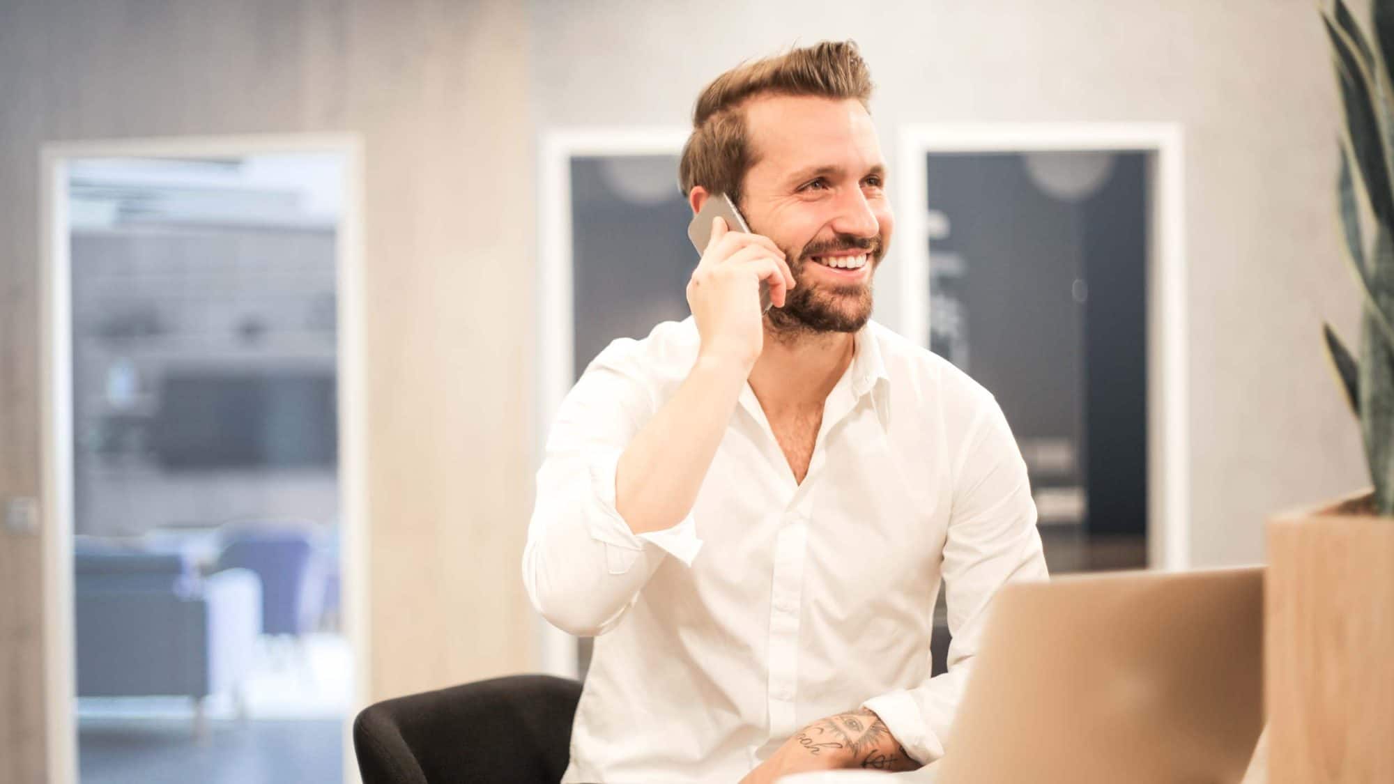 Man holding phone in office