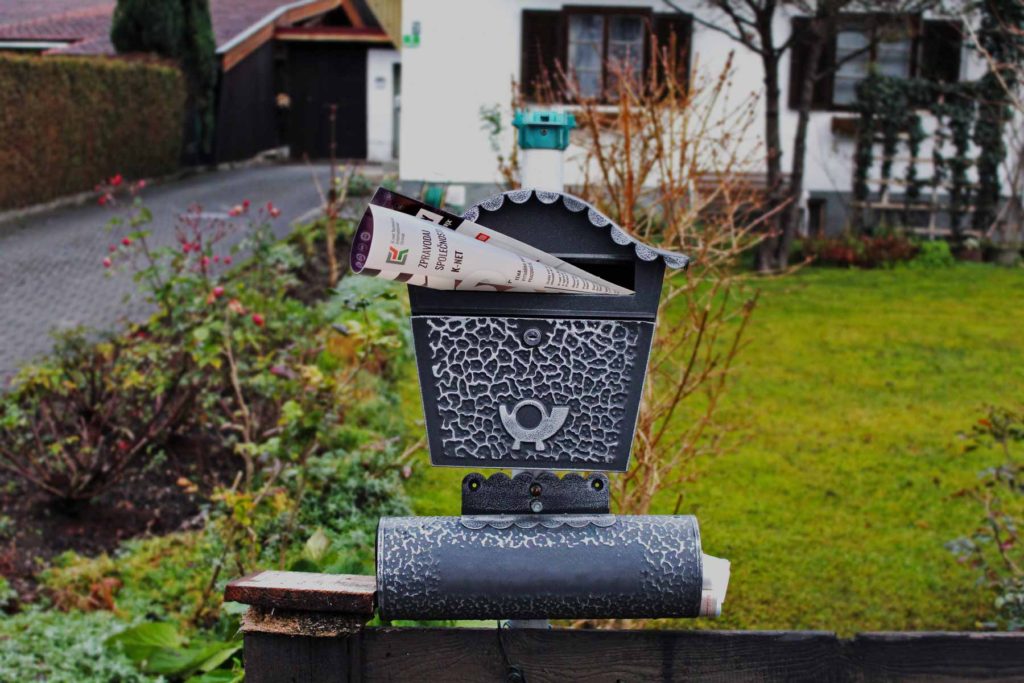 Our magazine Login in a letterbox in front of house