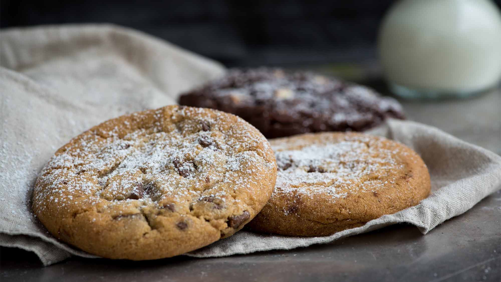 View of two nature cookies and one chocolate cookie