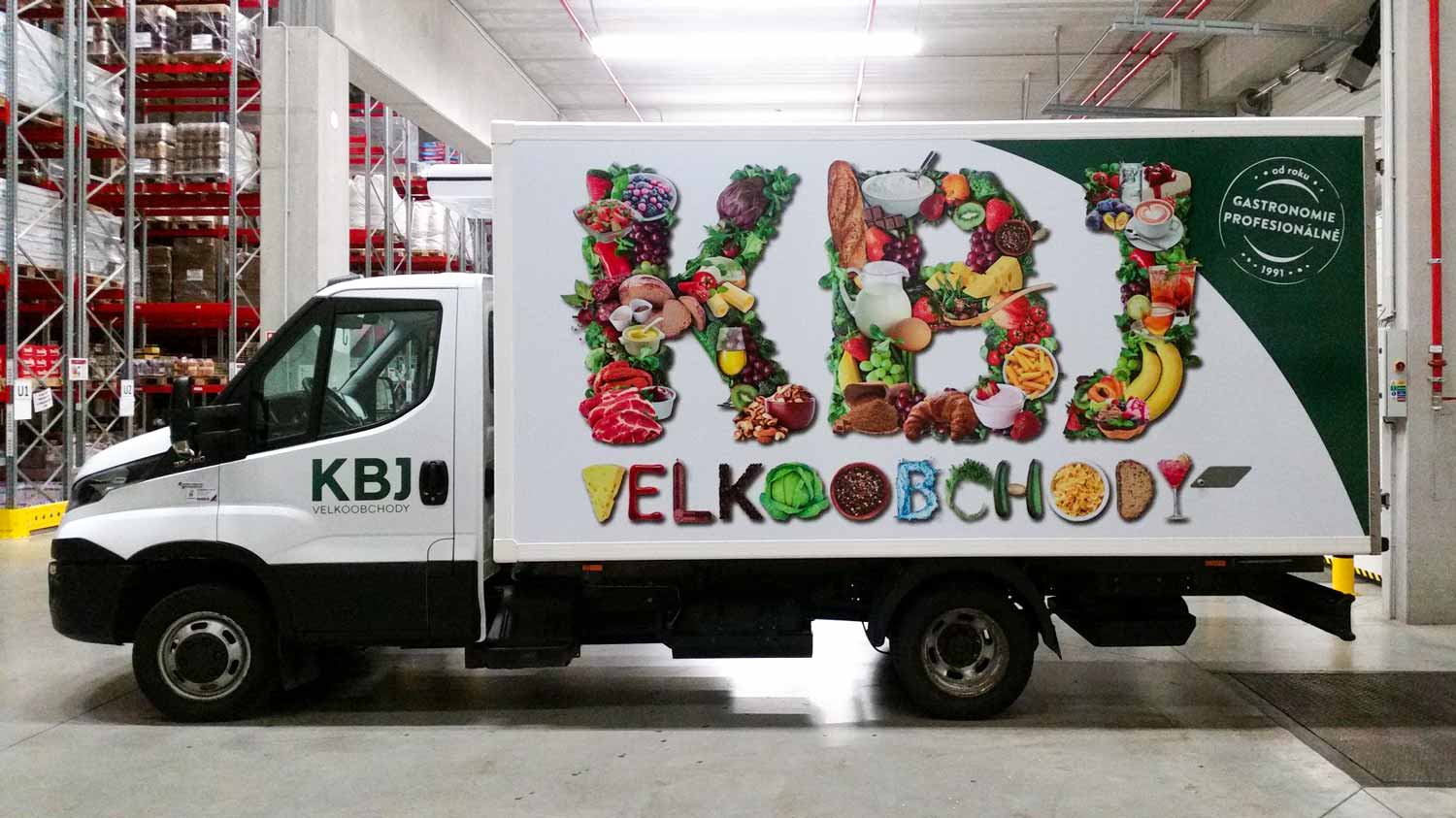 View of the KBJ's truck with a big logo made with pictures of fruit and vegetable