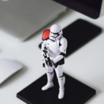 A stormtrooper guarding a computer from attack