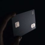 Black and gold credit card in dark shadow